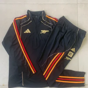 Fato de Treino ARS 2025-26 - Camisola com Fecho